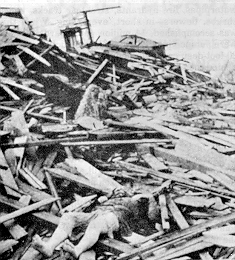 A body lies half buried among the ruins at 21st Street and Avenue O in Galveston